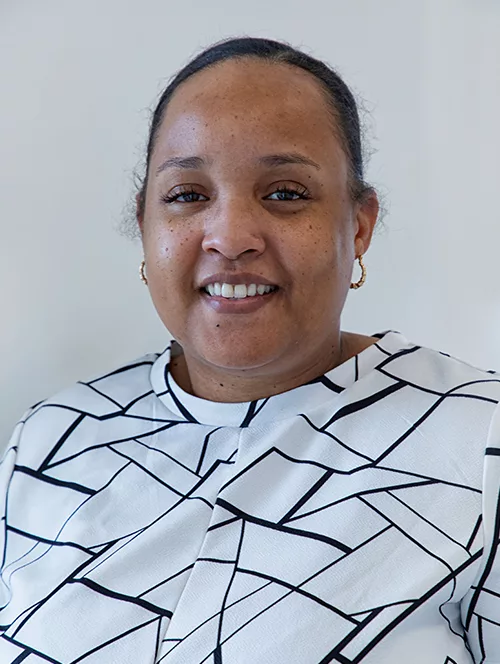 Head shot of Reann Baptiste staring at the camera.